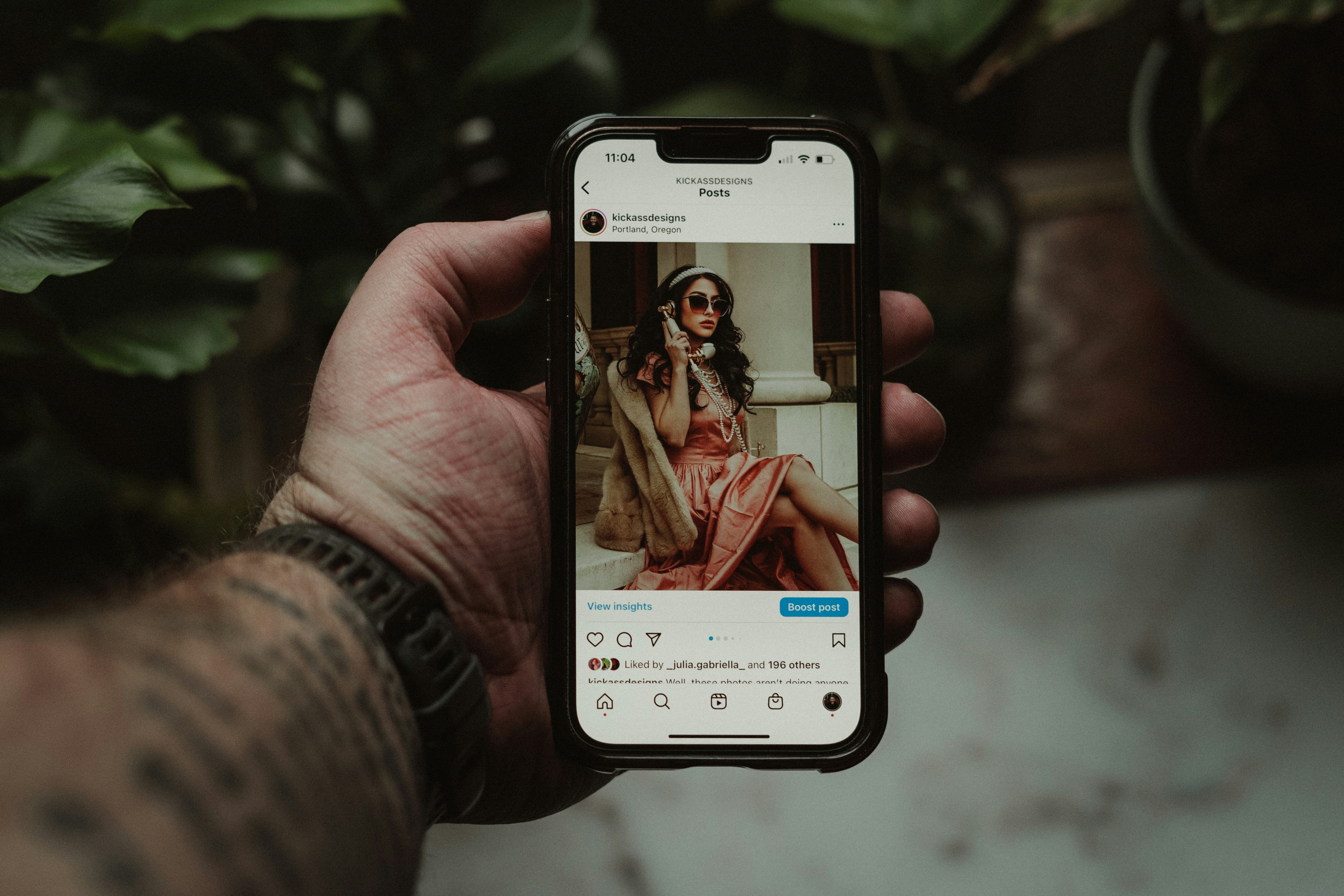 Scrolling my Instagram feed on my Iphone. Photo by Social Media Addict Lance Reis